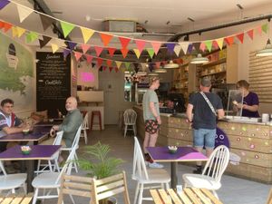 The cafe seating, with the street doors open on a lovely sunny day  at Baboo Gelato in Swanage