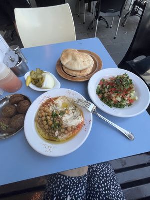 Falafel, humus, salad, pita and pickles   at Abu Dhabi Hummus in Tel Aviv
