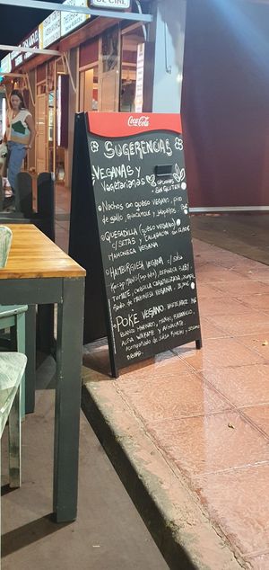 Clear sign listing all the vegan options at Carallo in San Jose