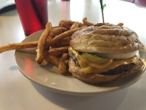 twisted green with vegan cheese, pickle, onion, ketchup and mustard with crispy fries  at Twisted Burger Diner in Flint