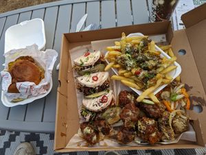 Chick'n satay burger, hoisin (seitan) duck bao buns, Korean chick'n wings, salt and pepper mushrooms and teriyaki broccoli dirty fries at Vegalution in Colchester