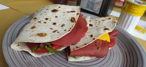 Piadina con affettato e formaggio veg, rucola e pomodoro at Piadina dell'Alba in Riccione