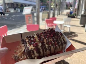 Hazelnut ice cream with my choice of toppings (raspberries, hazelnuts, coconut chips) and vegan chocolate sauce    at Happy Pops in South Brisbane