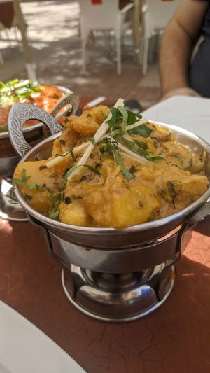 Cauliflower curry, on top some ginger and coriander at King of Curries in Benalmadena