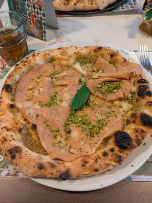 Pizza with pistachio and mortadella at Pizzeria Assaje in Milan
