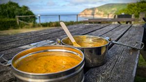 Chickpea curry and Dahl in the Spicy Mare reusable tiffin, sat in the church garden just up road at The Spicy Mare in Lynton