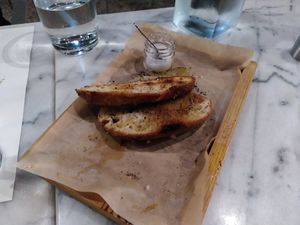 Typical Greek side dish: bread with olive oil. In this restaurant with extra salt. at Afrálato in Kalamata