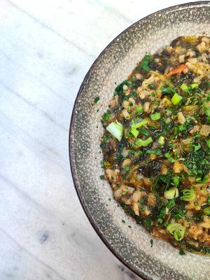 Cooked spinach with brown rice , herbs and lemon jus  at Afrálato in Kalamata