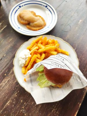 Potato pancakes with applesauce (in the back) and vegetable burger with fries at Beachhouse in Meinhard