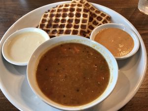 Dosa waffle with sambhar at Cheeni .  Coconut chutney on the left.  Spicy sauce on the right. at Cheeni Indian Food Emporium in Raleigh