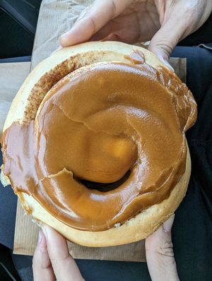 Huge caramel-topped cinnamon scroll at Brauðgerðarhús Akureyrar in Akureyri
