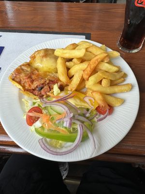Vegan lasagne with chips and salad  at Robertsons in Orkney Islands