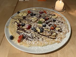 Banana chocolate with berries  at Pirmas Blynas in Vilnius