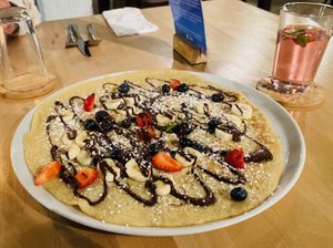 Pancake with banana and chocolate .  at Pirmas Blynas in Vilnius