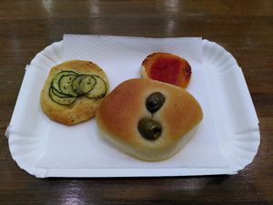 Plain roll with olives and mini pizza roll kind of things at Forno Roscioli Pietro - Esquilino in Rome