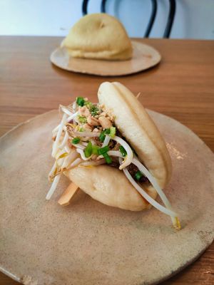 Bao bun with peanuts, oyster mushroom, cucumber, sprouts and herbs. at Dwa Stoliki in Torun