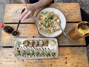 Pho Tron Chay and sushi at an outdoor table  at Quan Xua in Leipzig