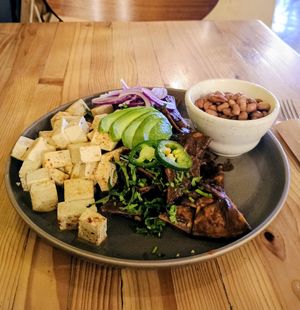 Chilaquiles con salsa de mole, tofu y frijoles enteros (⚠️ask for vegan salsa⚠️) at Avocato Cocina Creativa in Puerto Penasco