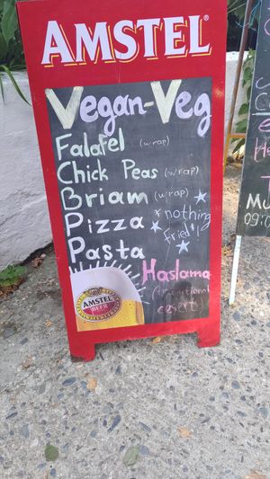 Sign showing the vegan options outside at Pansion Galini in Kamariotissa