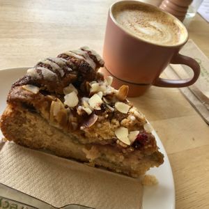 Rhubarb and raspberry cake, oat milk latte  at BRAF in Caernarfon
