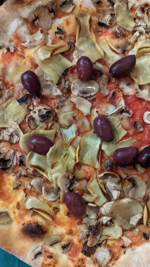 Artichoke pizza (summer only) with added tomato sauce and black olives. Great quality ingredients. at PIZZERIA OLIVA in Dubrovnik