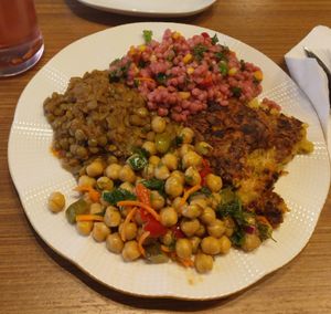 Chose the 4 option plate. Lentils, chickpea salad, couscous salad, and a zucchini pastry ! I mean truly so good and delicious. at Wegain in Istanbul