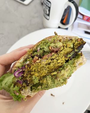 What's inside? Vegan falafel burger with guacamole and homemade sourdough bread. at Dzen of Food in Yerevan