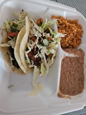 Taco plate (Califlor taco and champignones pibil taco) with beans and rice. at Tanias 33 Dos Mundos in Tucson