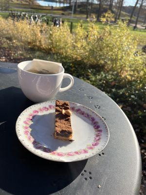 Vegan snickers cake and green tea  at Kanaans Trädgårdskafé in Bromma