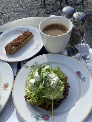 Open sandwich with vegan feta cheese and “snickers”. Oat milk for coffee  at Kanaans Trädgårdskafé in Bromma