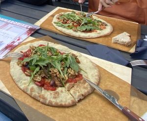 Pizza in their garden - swapped cows cheese for walnuts. Quite dry and boring though  at Kanaans Trädgårdskafé in Bromma