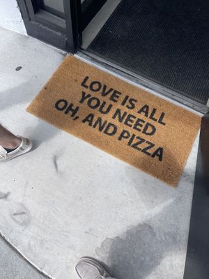 Cute doormat   at Tricycle Pizza in Seaside