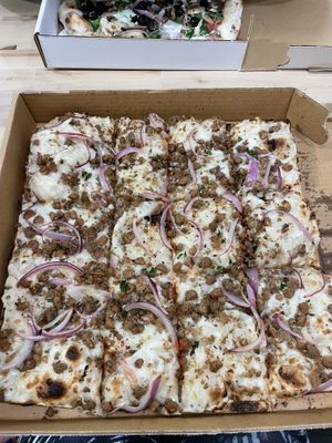 Sausage and white truffle square pizza 🤤  at Tricycle Pizza in Seaside