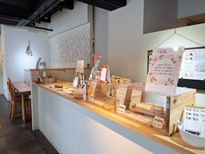 Service area and table for eating in at Herb Laboratory in Kobe