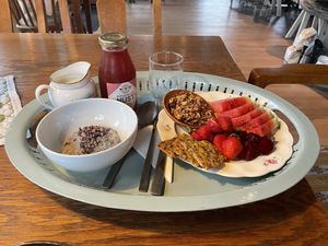 Vegan breakfast with granola, chia pudding, lots of fruits and oat milk  at Vischan's Bageri in Lidkoeping