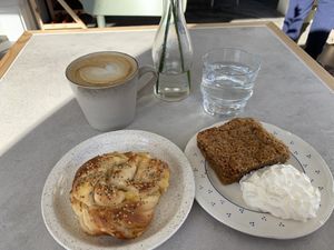 Carmel latte, cheesy bread and coconut coffee cake   at Plantan Kaffihús in Reykjavik