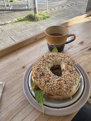 Bagel with vegan cream cheese, marinated carrots, cucumber, and pickled onion   at Plantan Kaffihús in Reykjavik
