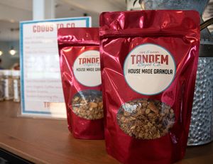 Our house-made granola is vegan and delicious! Rolled oats, maple syrup, almonds, light brown sugar, olive oil, coconut chips, pecans, canola oil, almond extract, and salt. at Tandem Bagel Company in Hadley