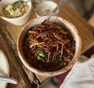 A rice and lentils dish with fried onions on top! Perfect to go with any entree.  at Adamá in Oaxaca