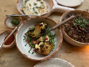 This roasted cauliflower came on a bed of the most delicious green sauce and pomegranate seed. #Succulent   at Adamá in Oaxaca