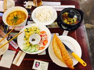 bahn mi with scrambled egg, curry soup, hot pot at Minh Hien in Hoi An