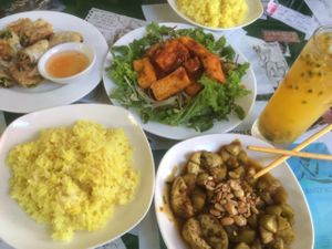 aubergine, garlic fried rice, fried spring rolls, tofu and passion fruit juice at Minh Hien in Hoi An