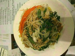 Rice with turmeric, mango and tofu skin (39k), what you see is a thin layer of dressing under which there is a whole platefull of (cold) rice!  at Minh Hien in Hoi An