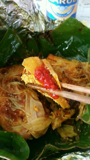 Stuffed tofu w onion, mashrooms, garlic and curry rolled in banana leaf and steamed (have a bit of a sweet flavor)  at Minh Hien in Hoi An