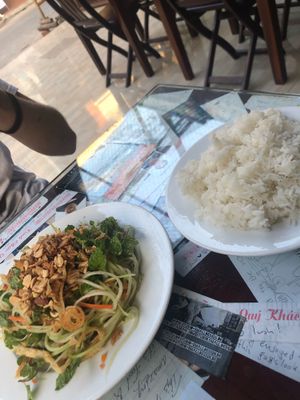 Papaya salad (left) which was a perfect dish. And side of rice 15000 vnd worth at Minh Hien in Hoi An