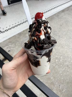 Sundae, vegan vanilla, chocolate sauce is vegan, add Oreos. It comes with the cherry.  at San Marco Dreamette in Jacksonville