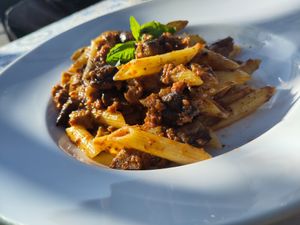 Penne alla Mediterranea, short pasta with pesto made from eggplant, sun-dried tomatoes, almonds, mint and fresh basil. at Pizzeria Damino in Angera