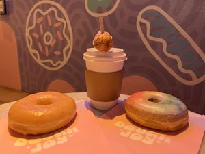 Coffee comes with a donut hole!  at Dough Joy in Seattle