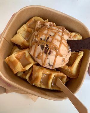 Bueno scoop with Lotus Biscoff sauce on waffle bites with edible spoon  at Plan(e)t Ice Cream in Athens