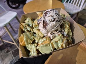 Fresh waffle bites with pistachio praline and bueno ice cream with chocolate crusts at Plan(e)t Ice Cream in Athens